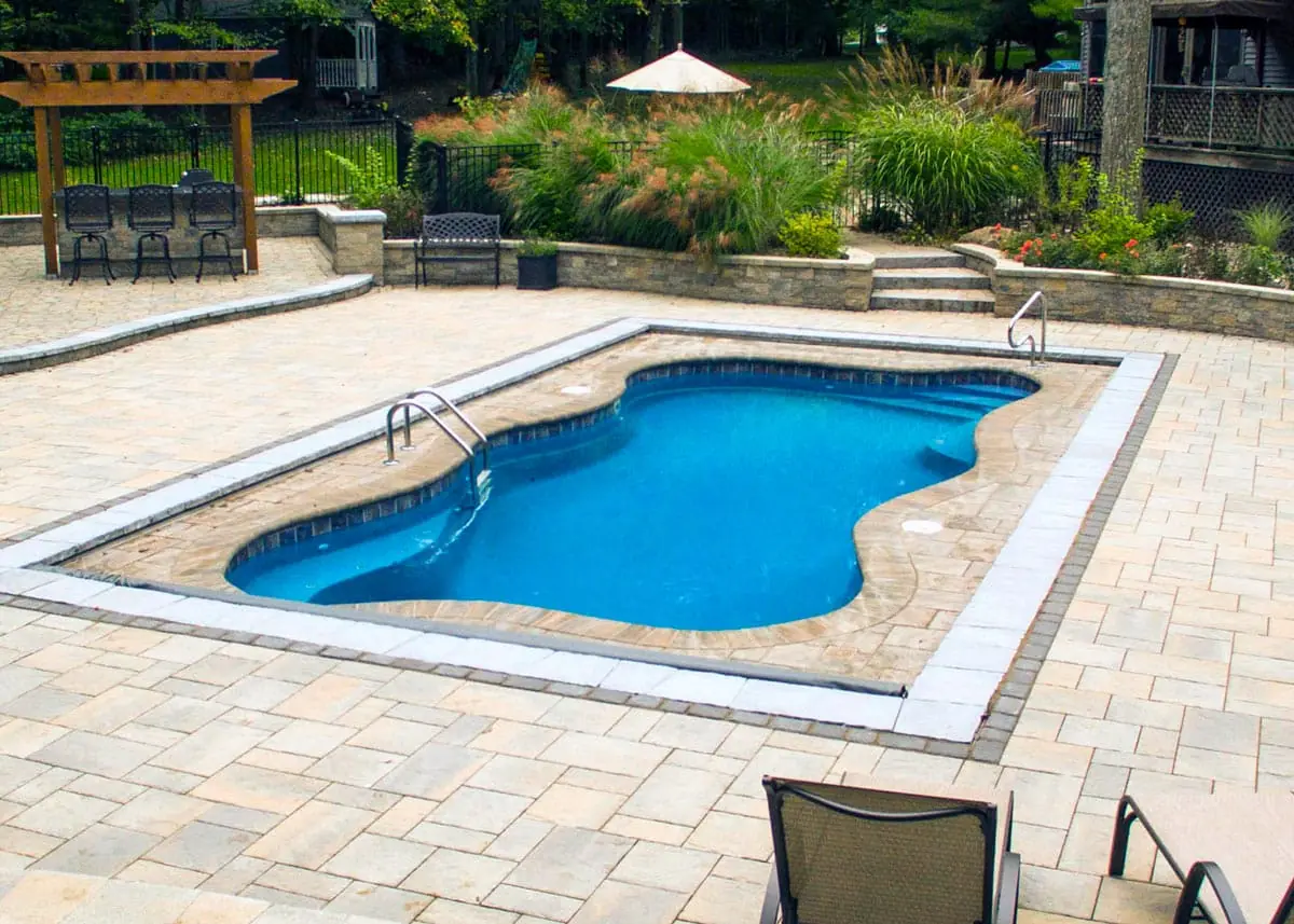 Cape Cod 14 freeform fiberglass pool installation, view 1